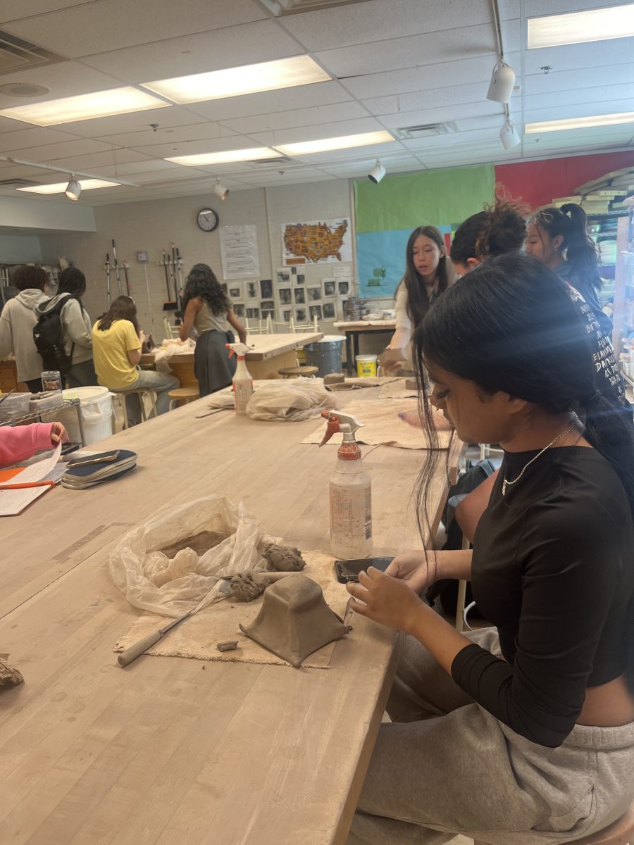 Sophomore Nusrat Nowsin completes a ceramics project during advisory on Apr. 16. Nowsin enjoys doing artwork in her free time because it provides a break from her tough schedule. Whenever I do art I feel happier and less stressed, Nowsin said.