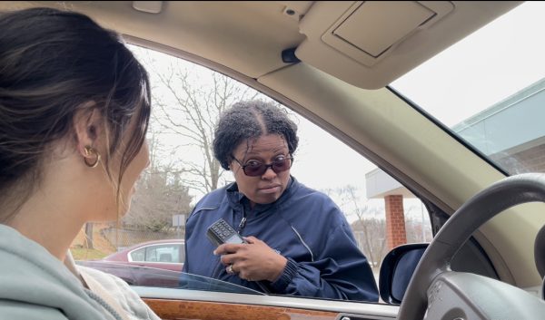 Rockville security team leader Teressa Holmes questions senior and  Common Sense reporter Maria Sofronas after her attempt to enter the school. Youre going to have to go around to the front of the school and enter through the main office, Holmes said.