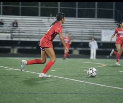 Second year varsity girls soccer sophomore Megan Lomotan dribbles up the field to start a counter attack for her team. Lomotan and her team were able to take finish the game with a 6-0 win over Blake.