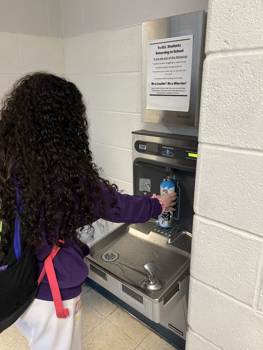 Junior Lexie Lindauer fills up at one of the water fountains throughout school.
