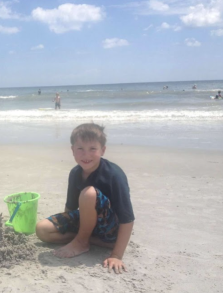 Junior Ryan Kaufman reminisces back to when he was six years old, enjoying a beach day during spring break with his friends and family.