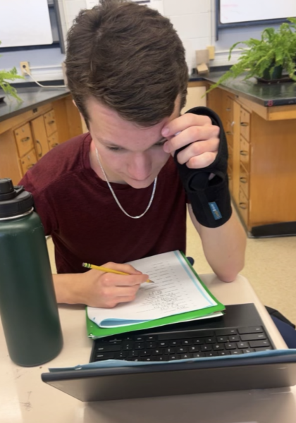 Sophomore Gavin Hall listens to music while doing chemistry homework. I love listening to rap and sometimes when Im studying Ill listen to classic music, Hall said.