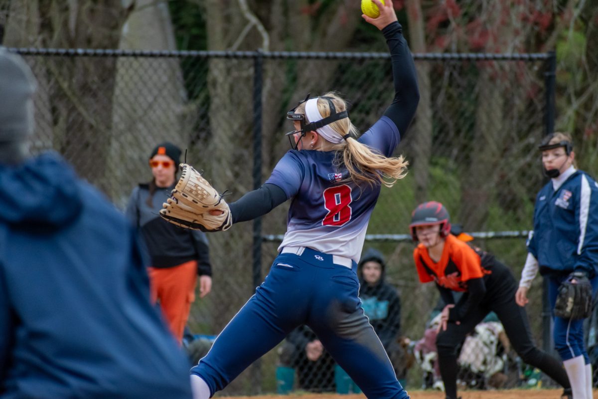 Freshman Megan Smith fires a pitch in the varsity softball game against Rockville. Smith allowed zero runs in their 1-0 win.