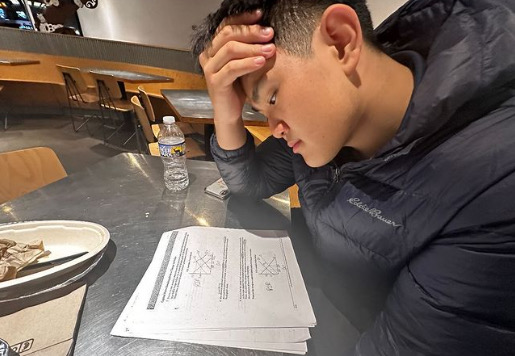 Senior John Wang studies for his upcoming AP exams at Chipotle. When it comes to the stress of it, Im doing OK, but Im a little worried, Wang said.