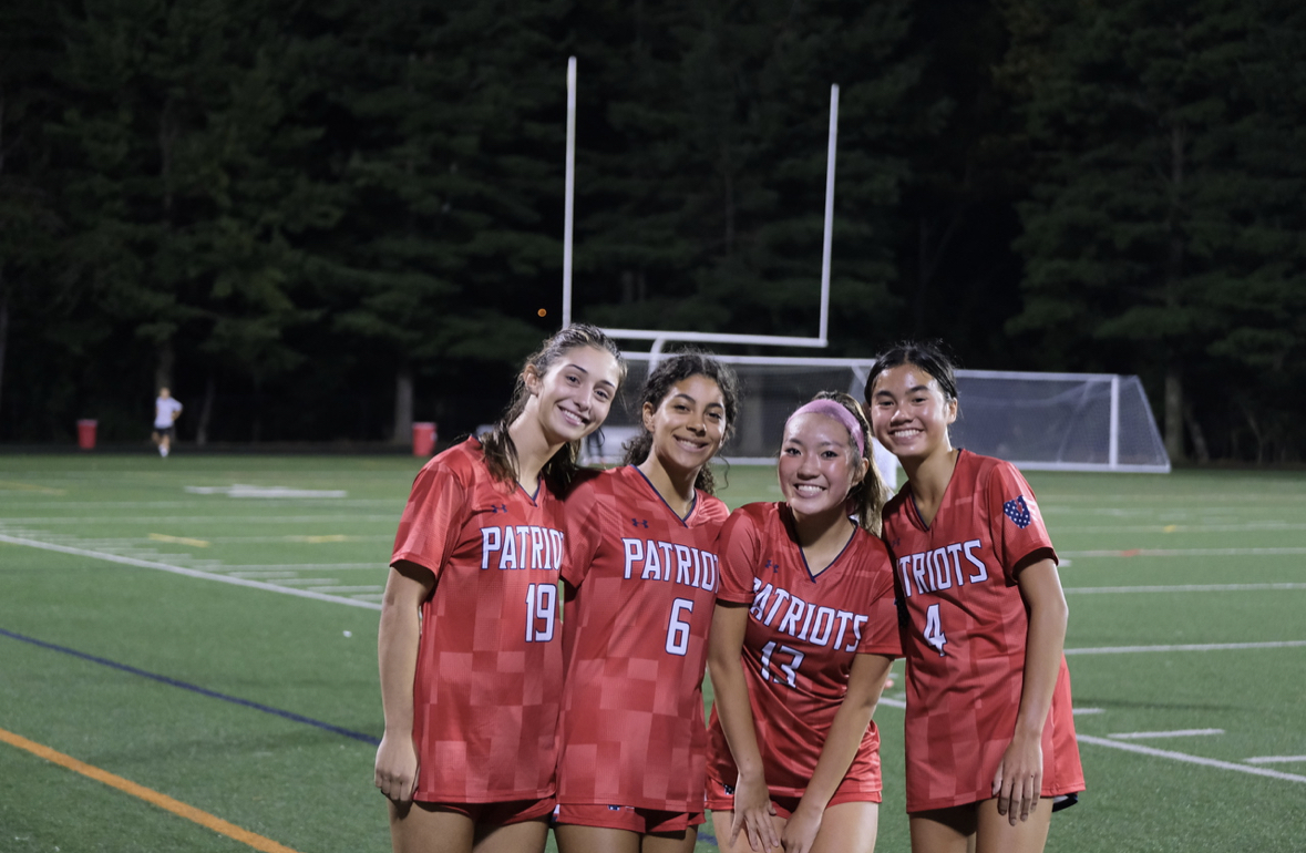 Senior Maria Sofronas #19 and sophomores Annalise Yi #13 (this writer), Megan Lomotan #4, and Izzy Caban #6 sport their new jerseys during their game against Watkins Mill.