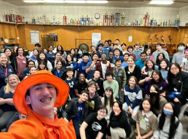 The marching band celebrates at their show reveal on Apr. 26. Im really excited to get to know everyone and make new friends, junior Collin Berman said.