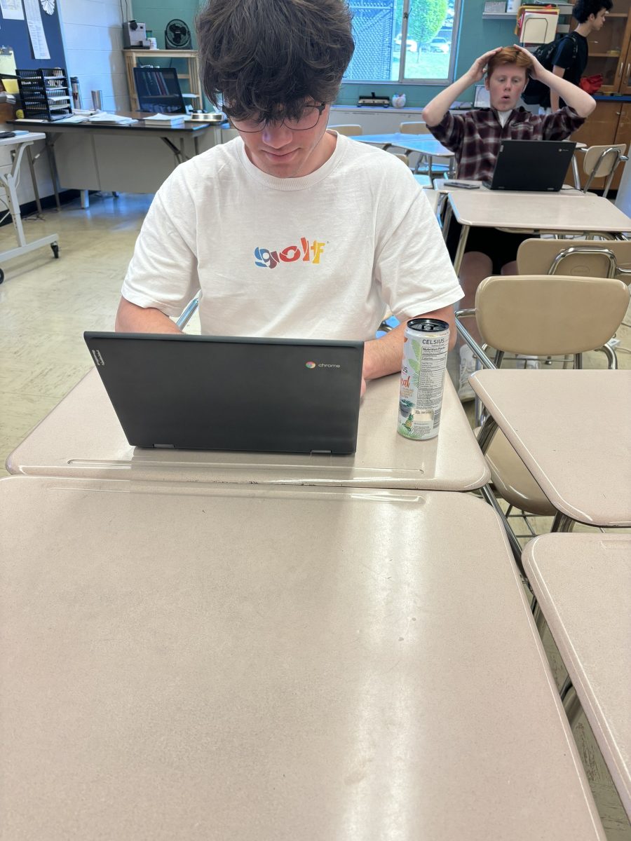 Junior Kai OBrian drinks a Celsius while he works on  an assignment for his honors modern world class. Drinking energy drinks helps me stay awake when I need to do work late at night and it helps wake me up in the mornings, OBrian said.  