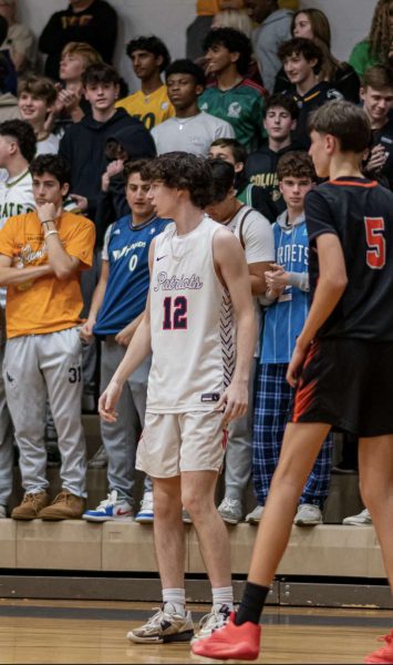 Junior Jack Sullivan is marked by a Rockville player in their matchup on Dec. 15. He attributes his success on the court to his dedication to his workouts.