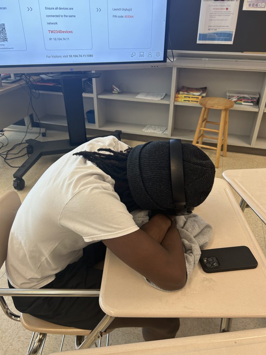 Sophomore Kioko Kibua relaxes during his eighth period health class after not getting enough sleep and a draining day of school.