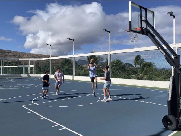 Junior Max Greenberg plays 2v2 basketball with his three brothers in Oahu, Hawaii.