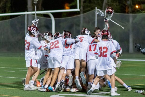Boys lacrosse celebrates after their 11-10 senior night win against Rockville on May 1.