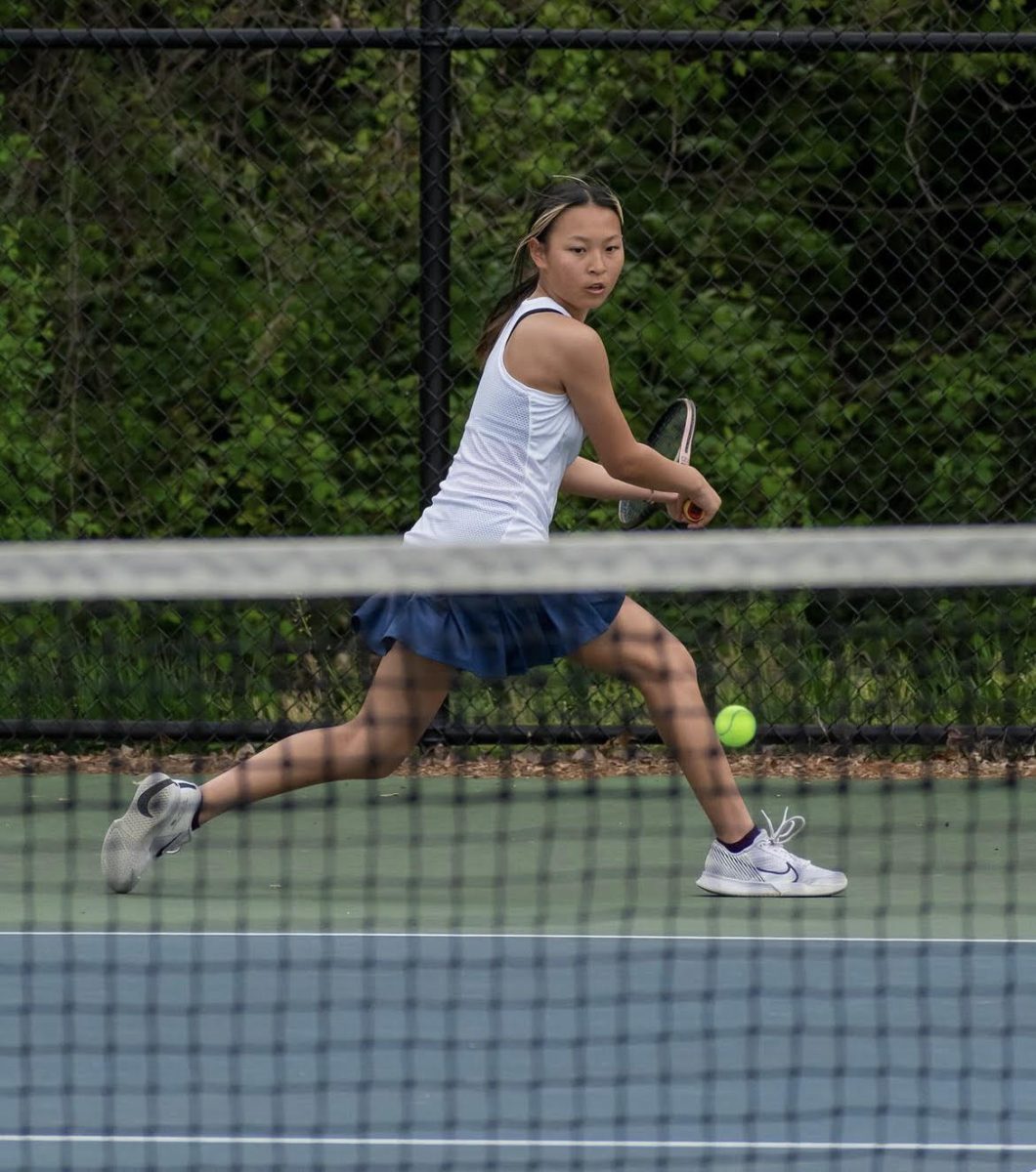 Sophomore Katherine Yao hits a hard backhand shot against her opponent during a match vs Richard Montgomery  on Apr. 18.