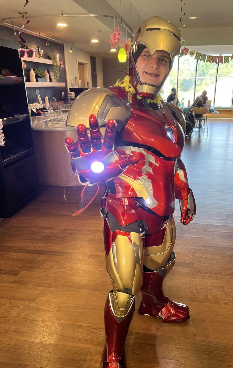 Senior Zachary Derman prepares for photo ops in his Iron Man suit at the Children's Inn at NIH.