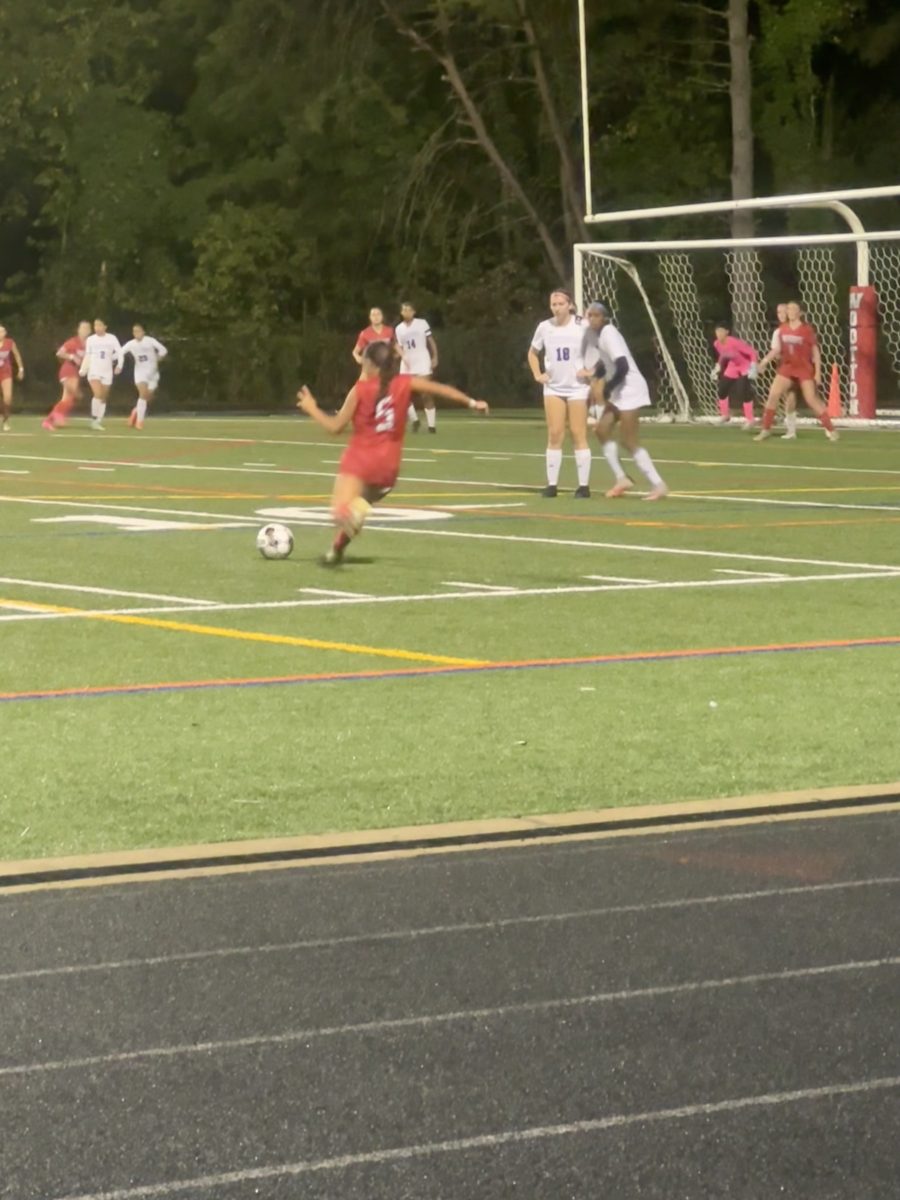 Freshman left back Hannah Yuan takes free kick at the game against Sherwood on Sept. 23. The Patriots won 2-1.