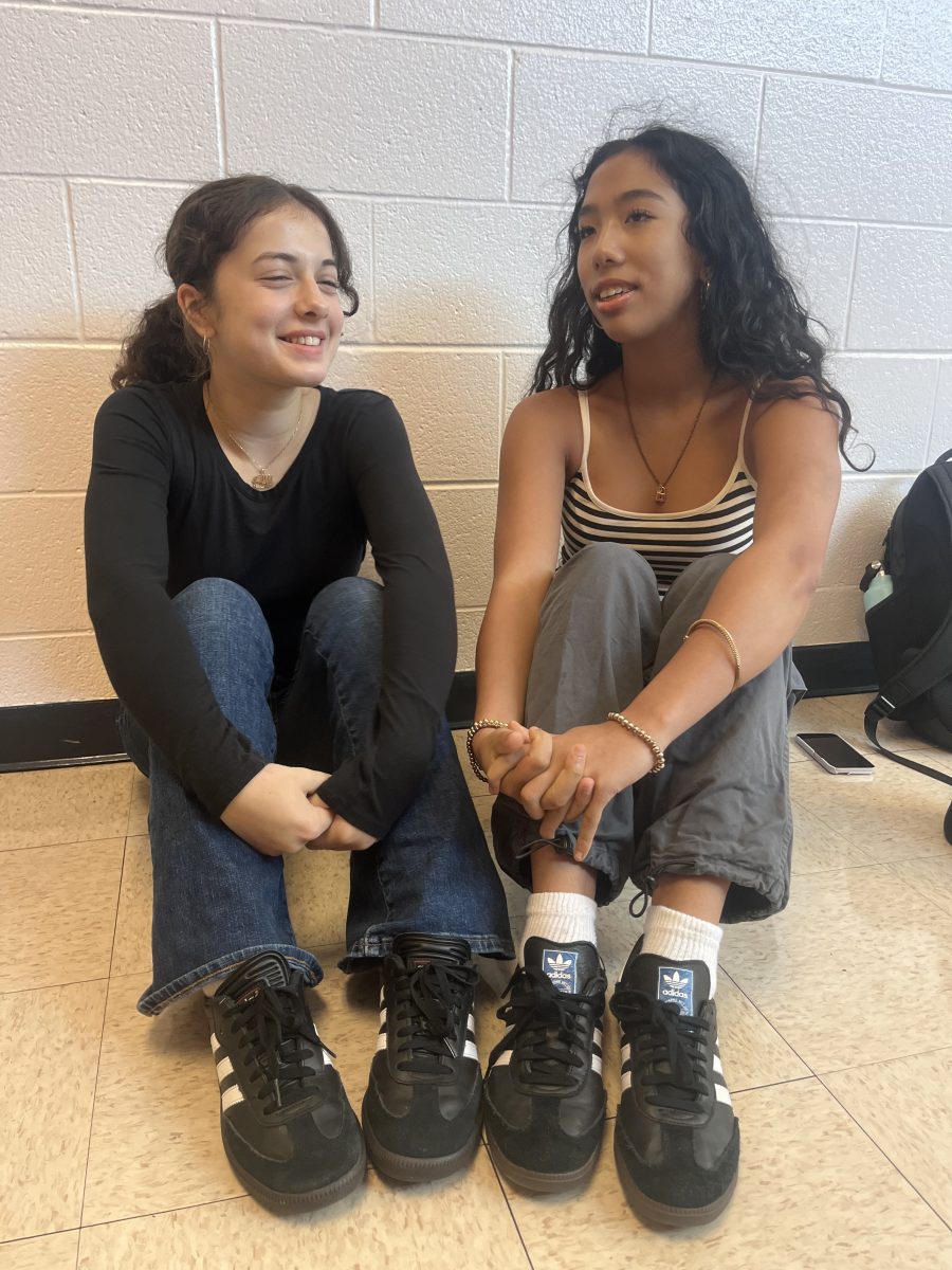 Junior Mona Olsen and sophomore Portia Spiker sit together during lunch comparing which pair of their black Sambas are more beat up than the other. "Mona's definitely look newer, because I've had mine for almost a year," Spiker said.