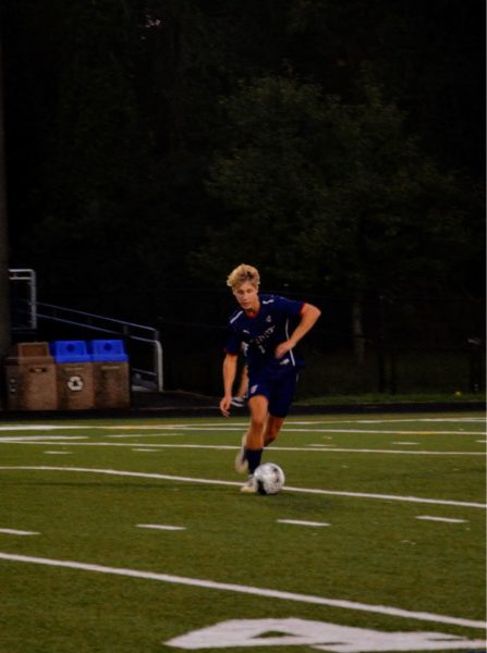 Senior captain Dilan Smith readies to pass the ball in the game against Poolesville on Sept. 11.