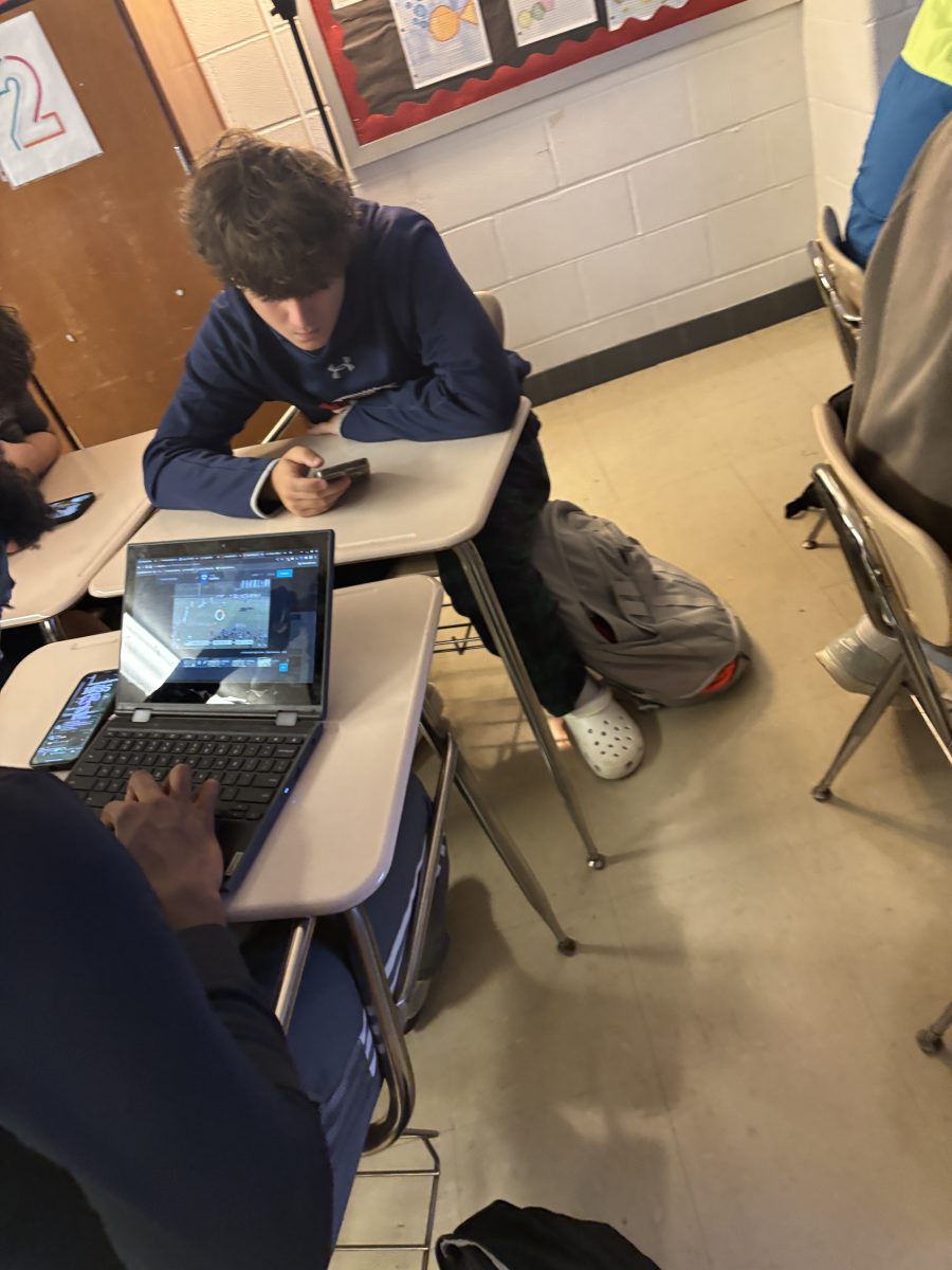 Junior Ethan Knighten sits with friends in math class. Last year he attended the now-closed Virtual Academy.