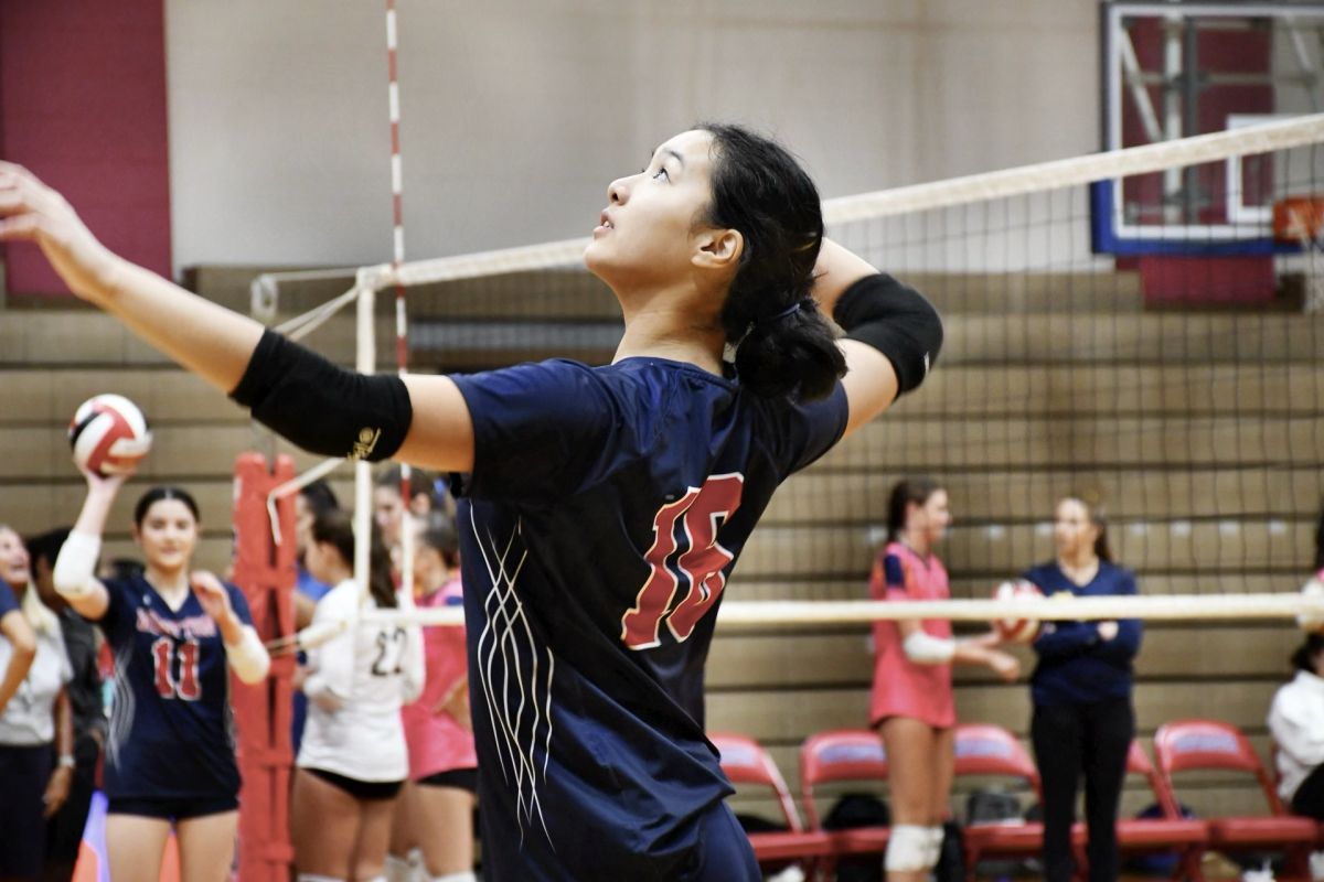 Sophomore Halie Ma serves at the opening home game against BCC on Sept. 9.  Wootton won 3-0.