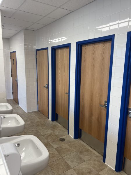 The new bathrooms have the sinks positioned in the hallway and two larger handicapped stalls on the sides. This design has proved to be an incovenience as students get used to the new facilities. 