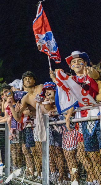 On Sept. 13 at the first home game against Rockville, seniors Parsa Hashemi, Abe Tare, Maddie Sisco, and Noah Friedman show school spirit by wearing red, white, and blue and cheering for the Patriots.