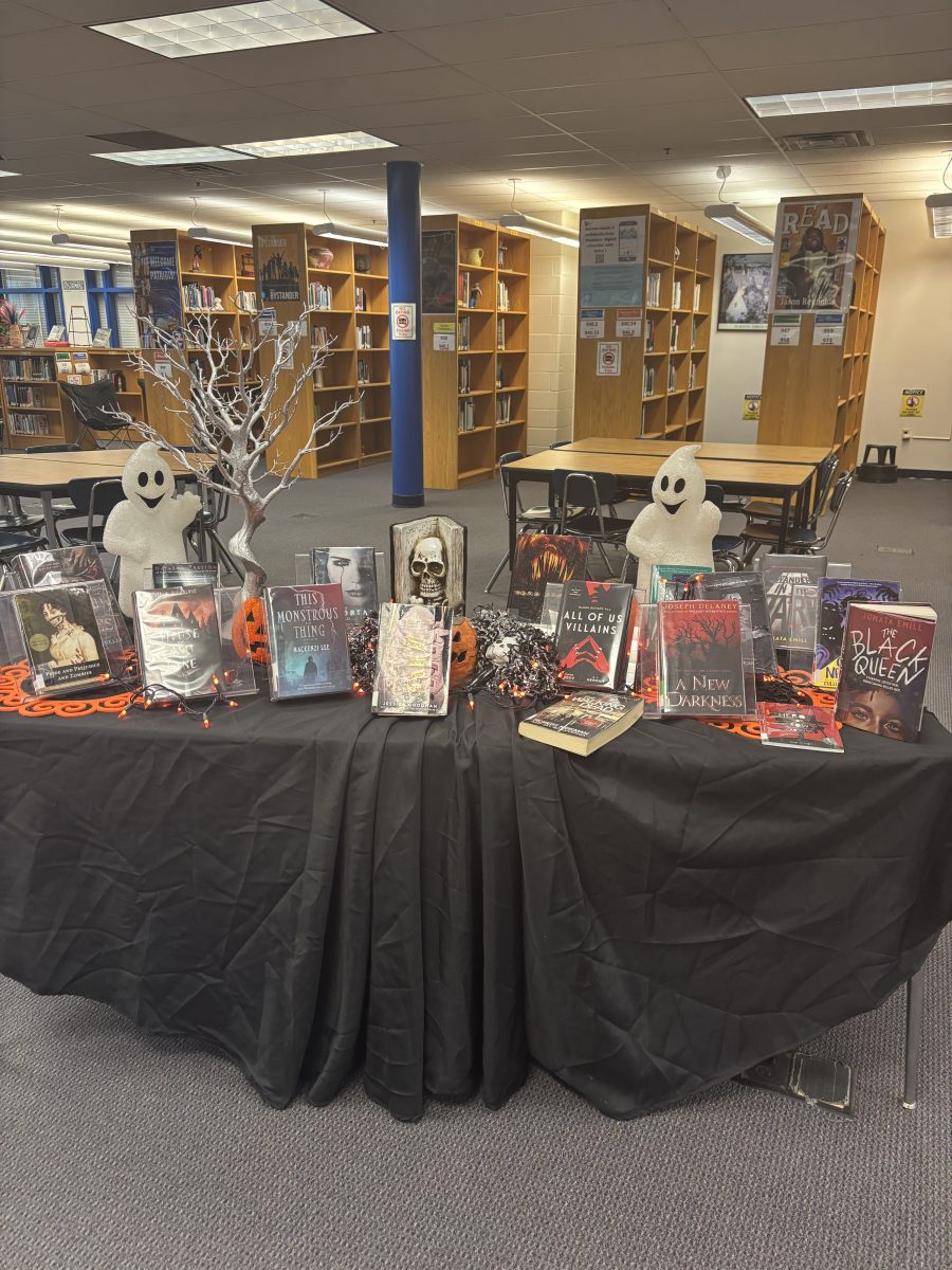 This school's library has a table set up for Halloween, promoting scary books for the month of October. They also had a challenge for students: if they read and reviewed two books, they were entered to win a prize. 