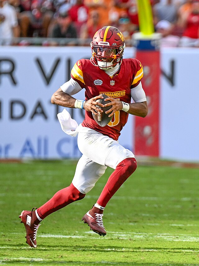 Jayden Daniels searches for passing options in his first NFL game against the Tampa Bay Buccaneers in Raymond James Stadium. Despite losing, he would lead the Commanders to a four-game winning streak following this game.