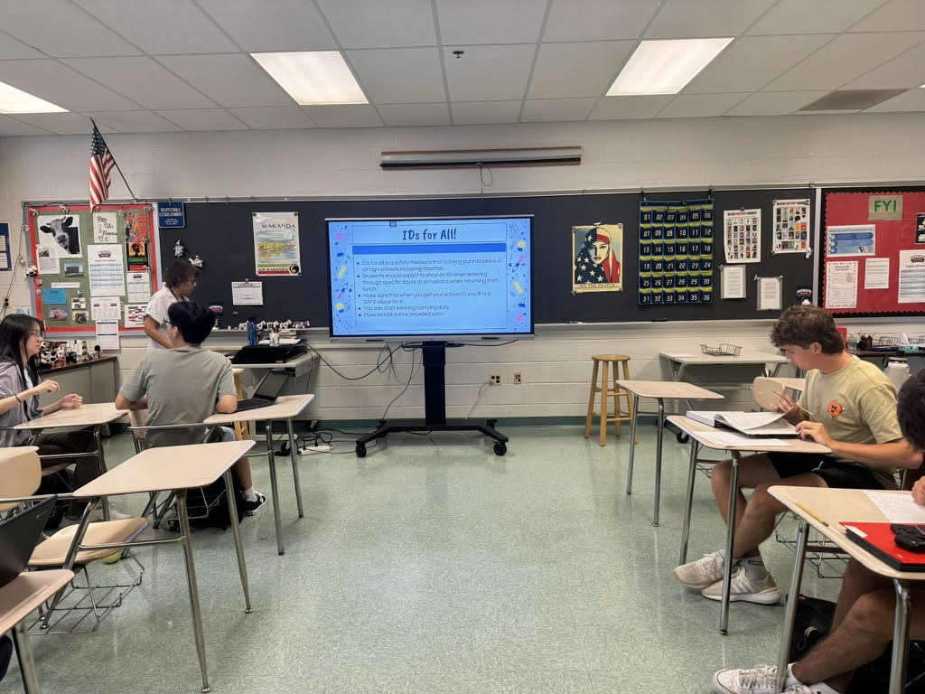 During the first advisory lesson of the school year on Aug. 28, English teacher Dominique Parker introduces the new ID policy to students in her second period AP Literature class.