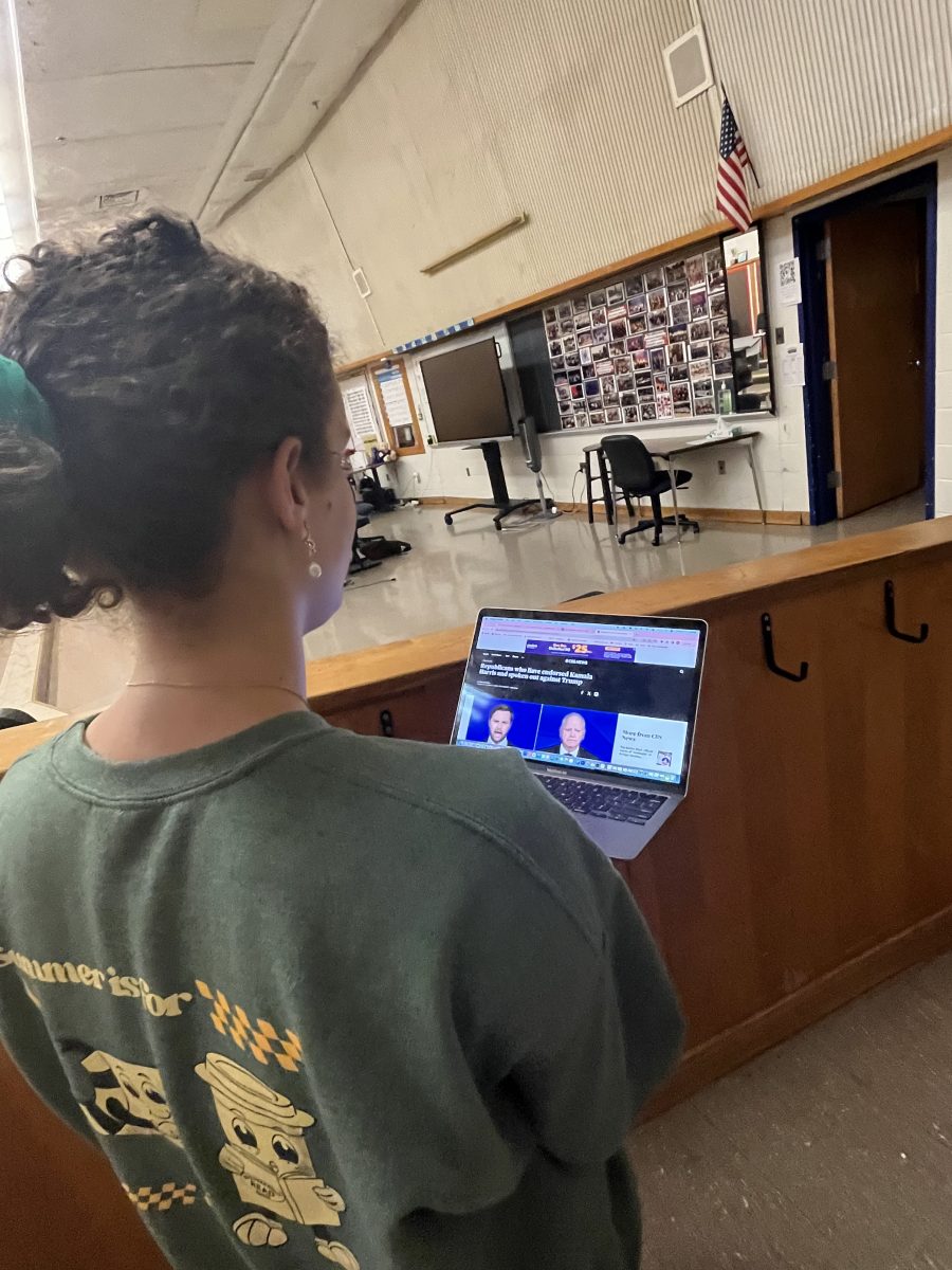 Senior Anna Lizondo reviews Republican presidential endorsements of Vice President Kamala Harris in between helping chamber choir students during lunch on Oct. 4. "I think endorsements by people from the Republican Party to Kamala are more influential, because they are less expected and really show how much they don’t want Trump to be in office... and also probably got some from the Republican Party to step back and think more about who to vote for," Lizondo said.