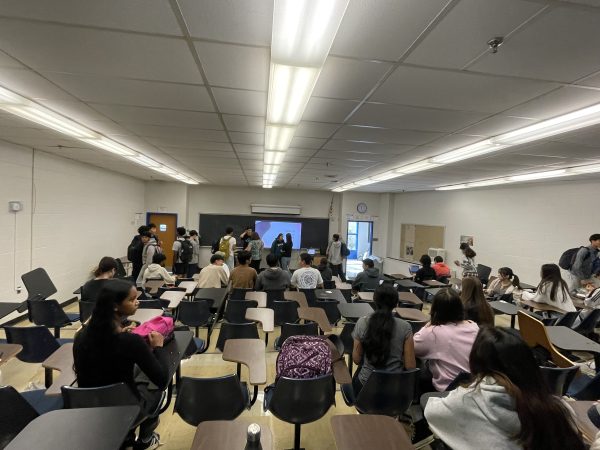 DECA leadership begin their weekly meeting in the lecture hall (Room 183) on Tuesday, Oct. 29, with the help of sponsors Ann Redman and Kimberly Gustin.