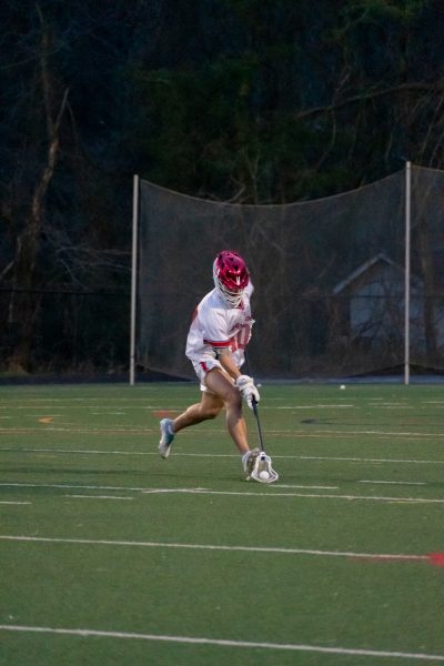 Senior Defenseman, and three-season athlete Matthew Deleon picks up a groundball in a game against Damascus on Apr. 9 of last season.