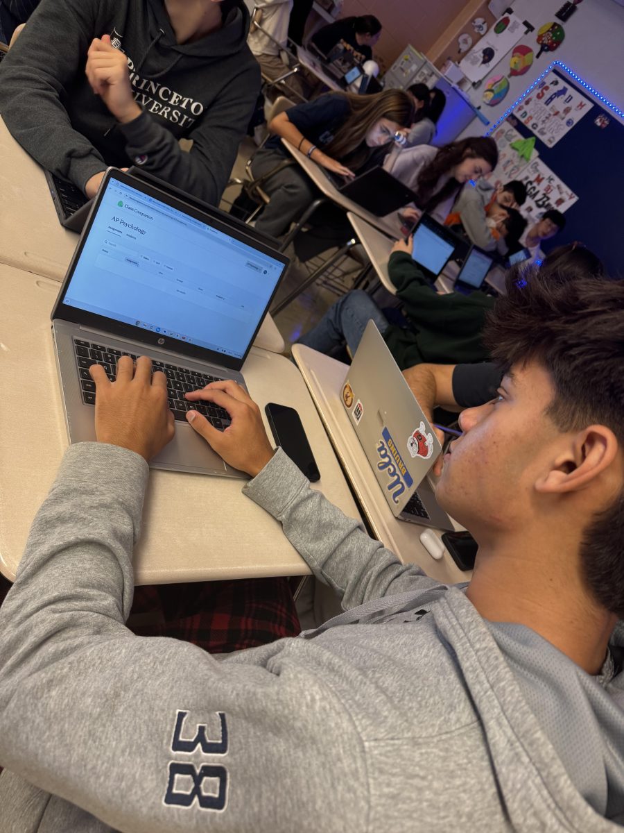 Junior Aadi Chaudhari works on the activity assigned to him on Class Companion by social studies teacher Amy Buckingham.