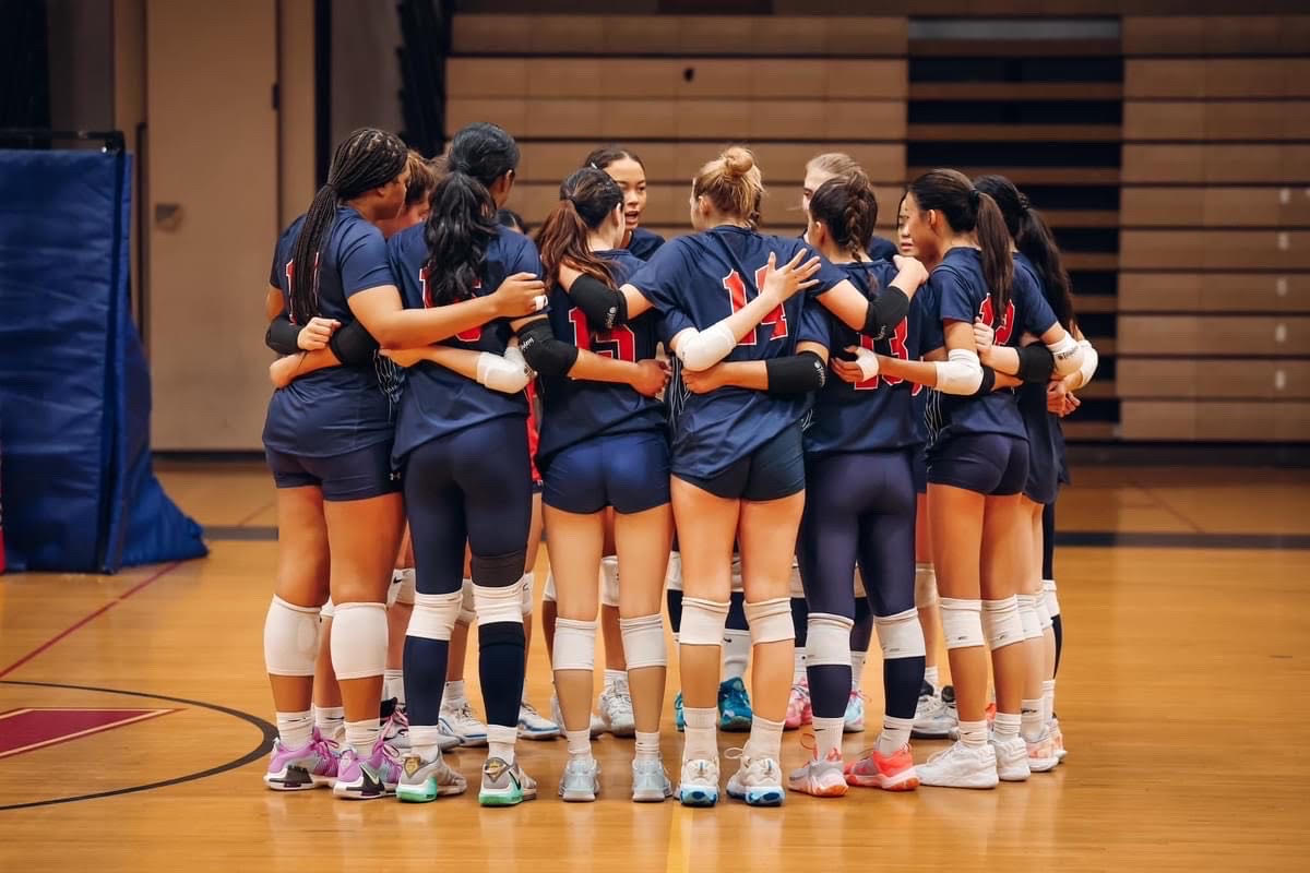 Varsity volleyball holds a pre-game talk before a scrimmage against Clarksburg at home.