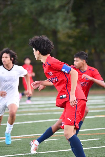 Sophomore Emmanuel Liu scans the field in a 2-1 loss against Blake on Oct. 8. "I would play games with tight muscles and tiredness in my legs. I think we had three or four games in one week once," Liu said.