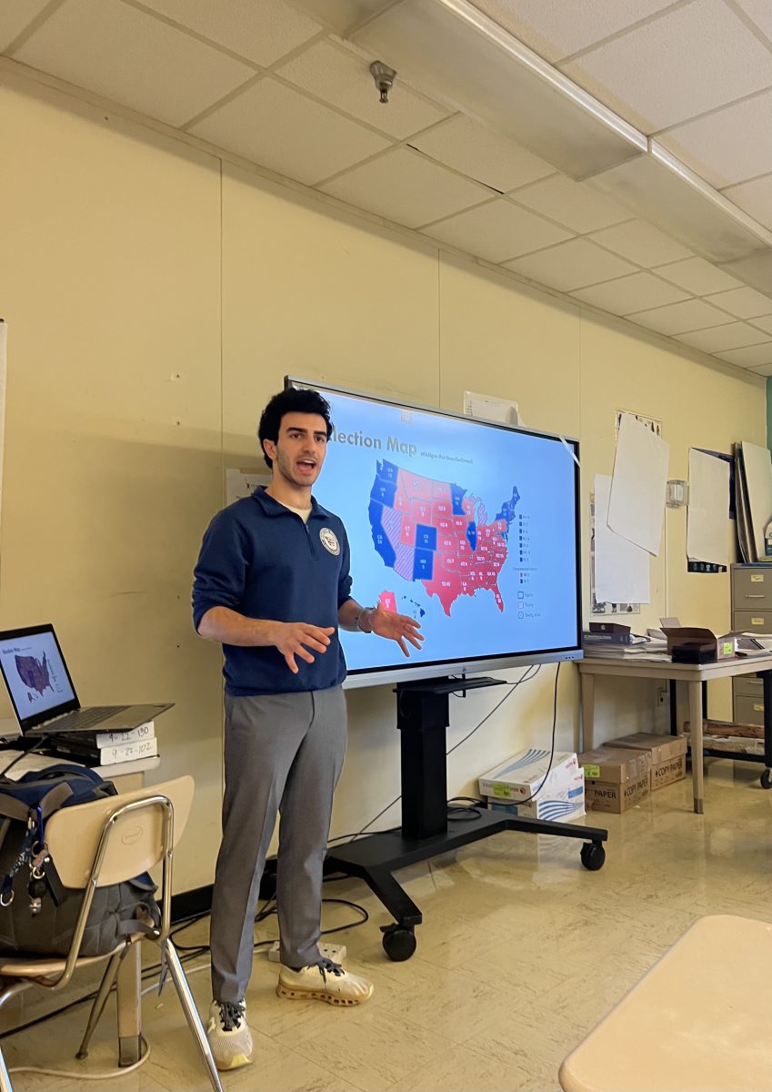 History Society President, senior Kian Hamidzadeh, presents at a meeting on Nov. 7 to debrief and discuss the results of the 2024 presidential election.