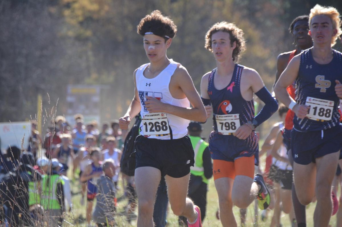 Senior Rendon Yerman (left) runs in the 3A state championship on Nov. 9. "It’s very important to be mentally tough for these long distances," he said.