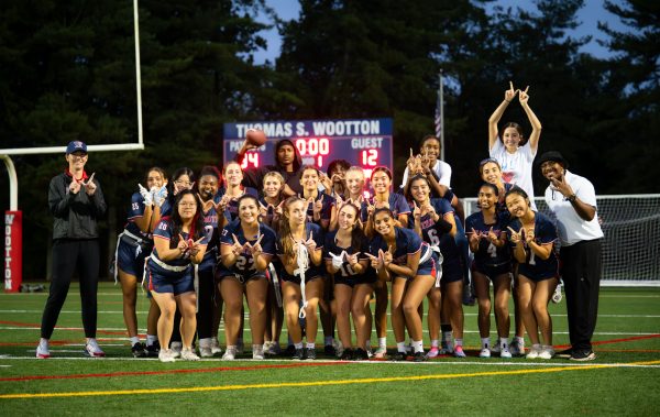 Varsity girls' flag football celebrates their victory at home against Bethesda-Chevy Chase.