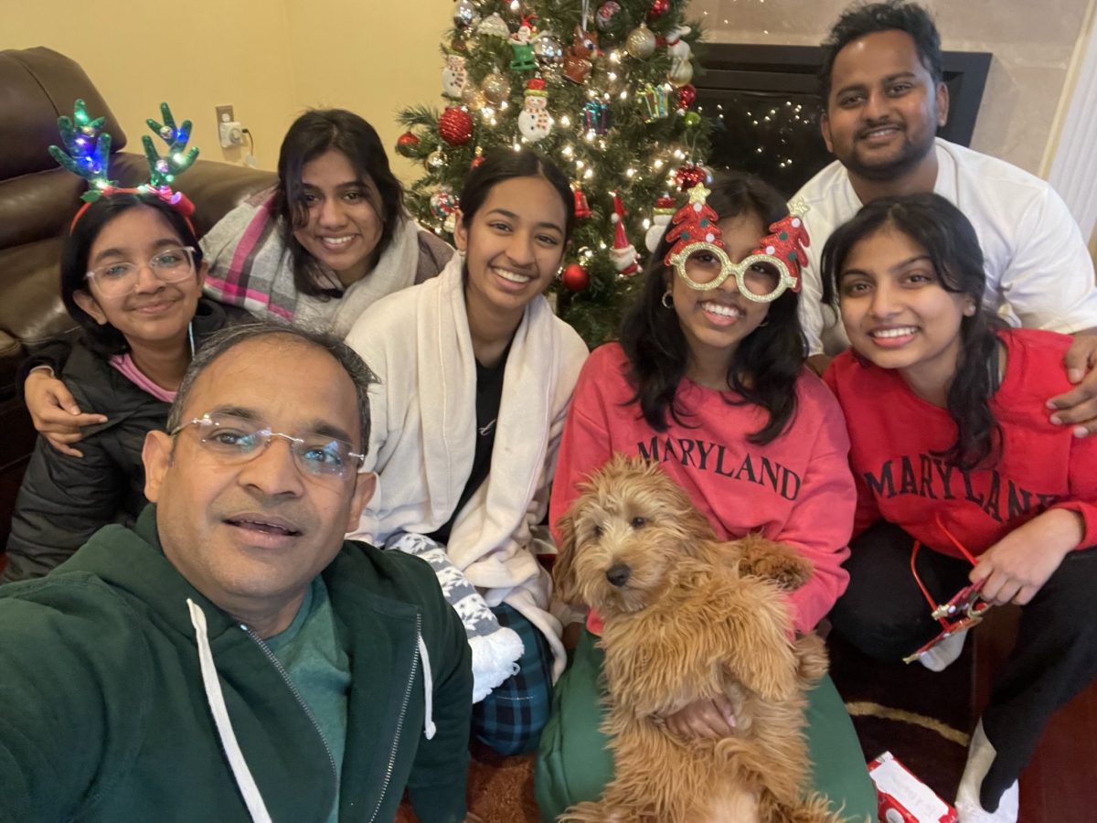 Freshman Mahita Dheenadhayalan celebrates Christmas with sophomore Ashu Khetan (this writer's sister) and senior Diya Khetan (this writer). "I enjoy getting together with not only my biological family, but also with my family friends who I've pretty much grown up with," Dheenadhayalan said. 