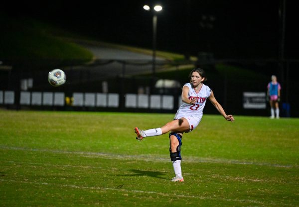 Senior captain defender Madeline Zincke plays a long ball to her attackers in a 3-1 win against Blake on Oct. 7.