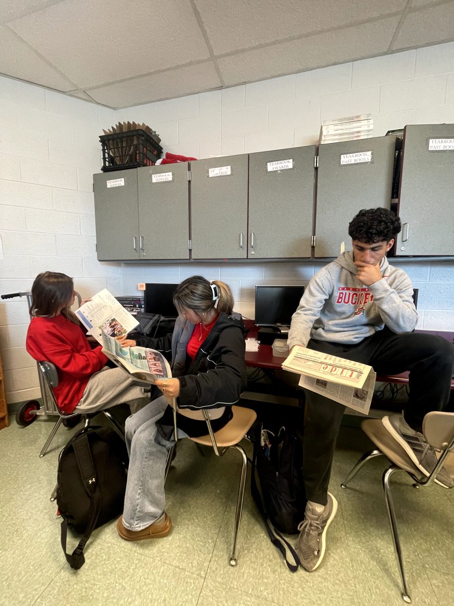 During newspaper class, juniors Siena McCarthy, Annalise Yi and Cyrus Kaz read Walt Whitman's "The Black and White," Walter Johnson's "The Pitch" and Richard Montgomery's "The Tide" for inspiration on page designs and article ideas. "I enjoy seeing other schools' ways of creating pages and their designs as well as the differences between which schools create magazines and which schools create true newspapers," Yi said.