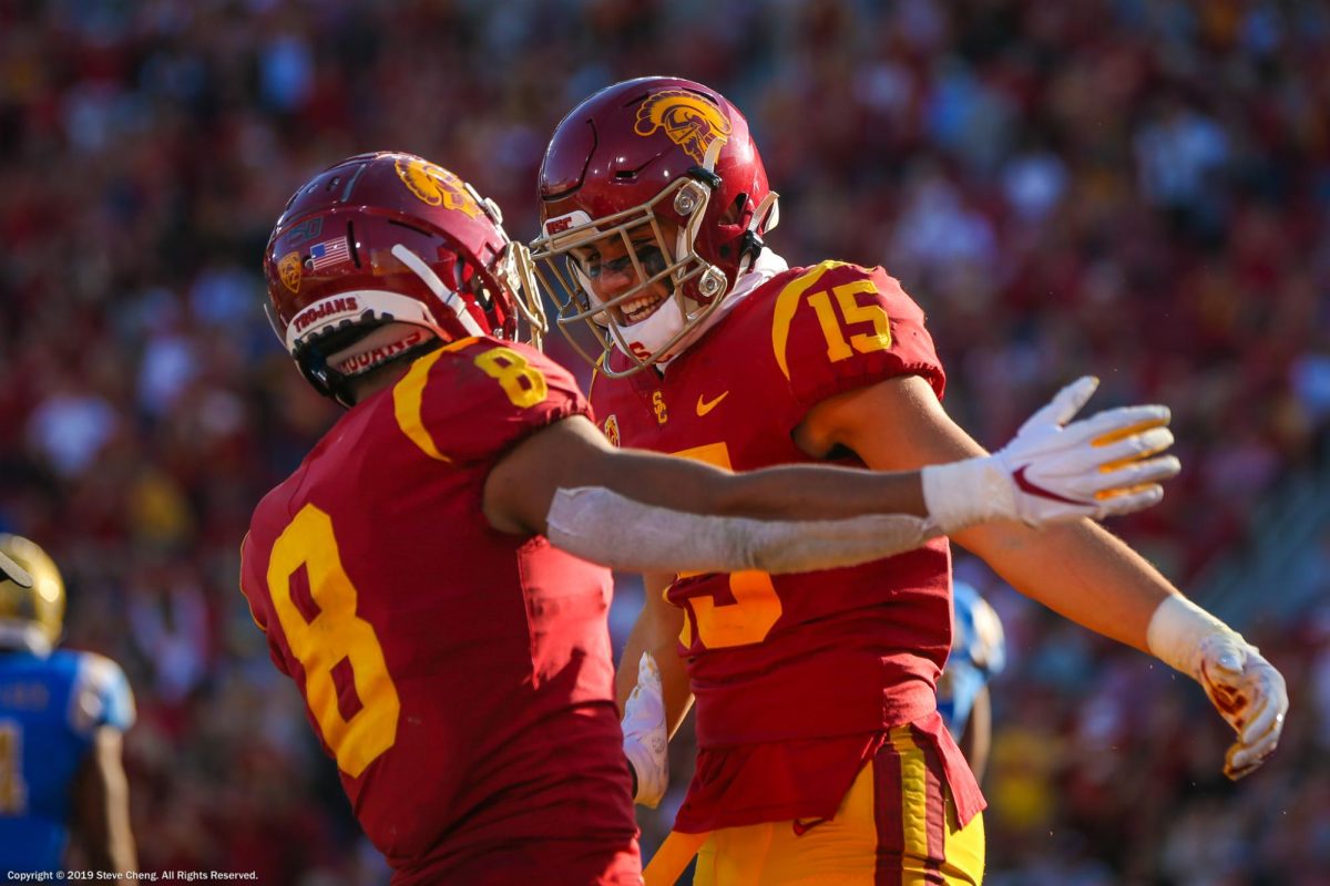 USC Trojans wide receiver Amon-Ra St. Brown (8) and Drake London celebrate after London's touchdown catch in 2019.