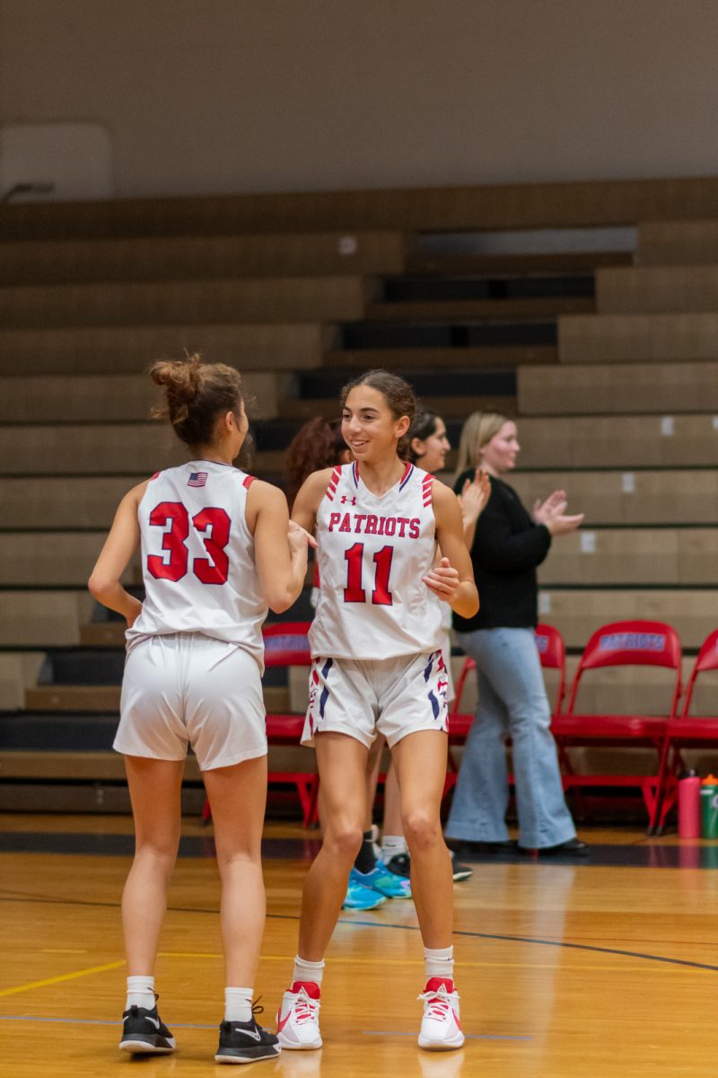 Junior Maya Bellamy and senior Naima Cho-Khaliq walk out before the Richard Montgomery game on Dec. 8, 2023. The Patriots fell to the Rockets 54-52.