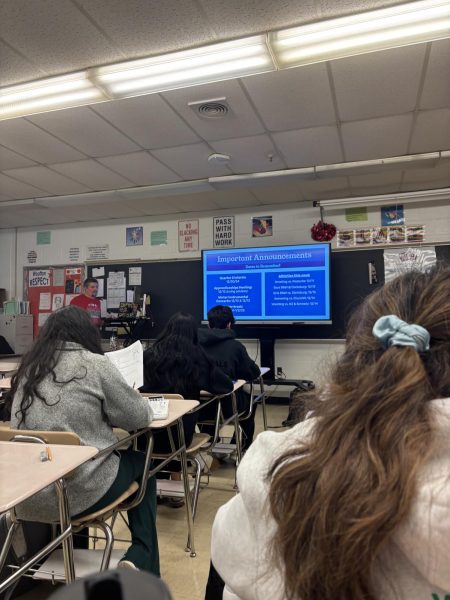 Math teacher Chris Schreckengost goes over the Wellness Wednesday lesson with his second-period AP statistic class on Dec. 11.