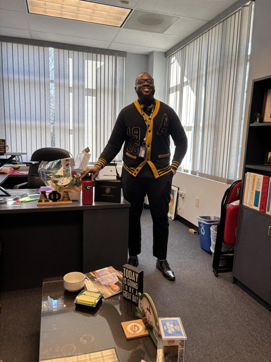 Acting Principal Dr. Joseph Bostic Jr. settles into his office at this school, adding his water bottle with a University of Georgia sticker and his diploma from Northwood High School.