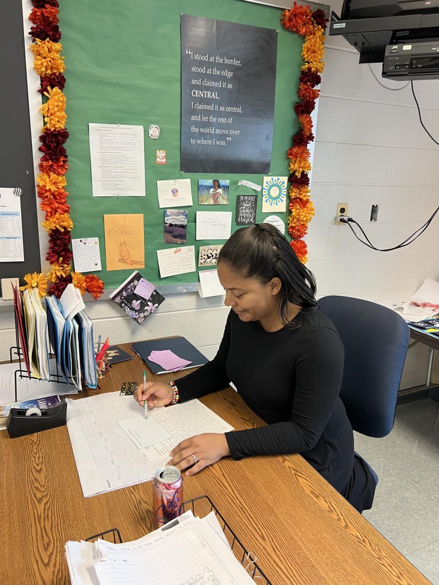 English teacher Lindsey Vance reads over a student's essay and provides feedback.