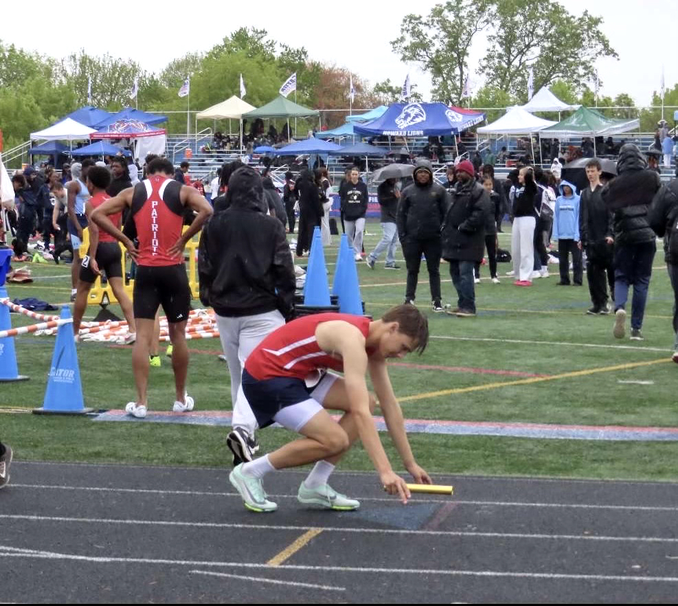 Junior Bryson Filbert sets up at the starting line for his event at the Gator Invitational in March 2024. "I'm hoping to improve my times and height for high jump this season." Filbert said.