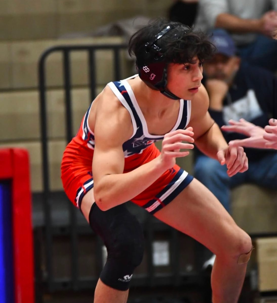 Sophomore Gianni Pizzi wrestles against Poolesville. The team lost 68-11 in the first match of the year. "My individual performances have been pretty good so far this year but they could be better," Pizzi said