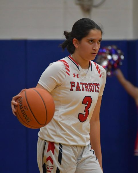 Varsity girls' basketball player Avni Koenig competes in the game against Rockville on Dec. 28. Balancing a challenging junior year schedule and a winter sport makes time management an essential skill.