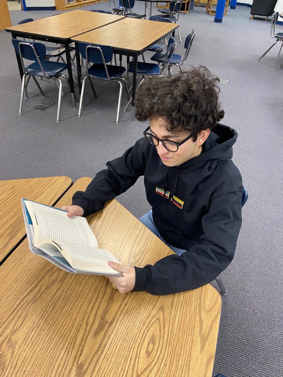 Senior Daniel Yaya fulfills one of his New Year's resolutions to read more books.