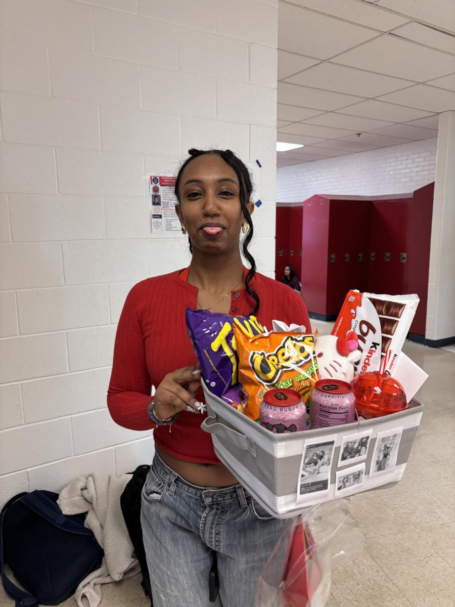 Sophomore Amen Tekleab shows off her Valentine's Day gift from her friend during advisory Friday, Feb. 14.