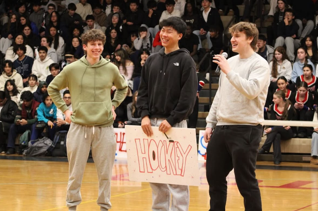 Hockey captains junior Justin Heller, senior Nathan Tai and senior Sam Hosier  hype up the pep rally crowd on Jan. 30 and give a speech about the hockey season.